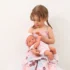 girl holding baby doll